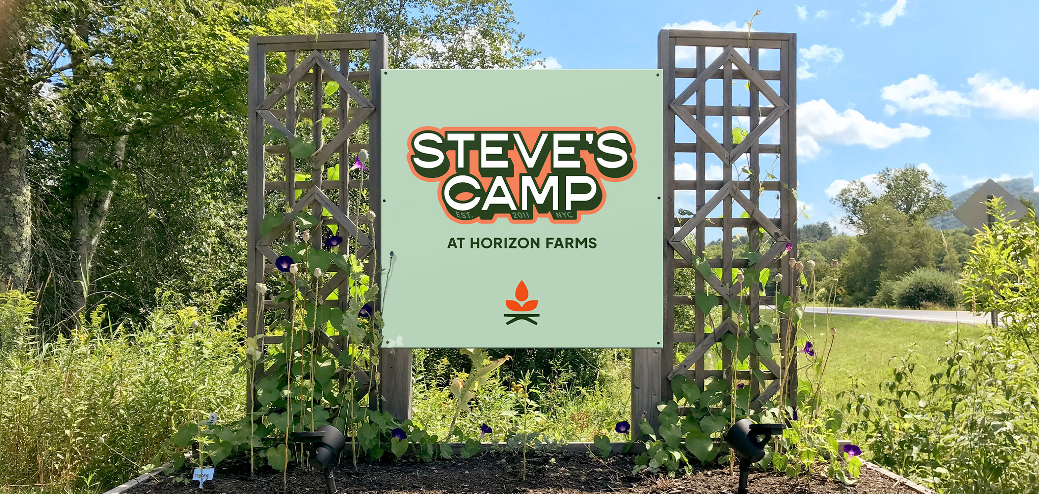 An entrance sign showing the camp logo