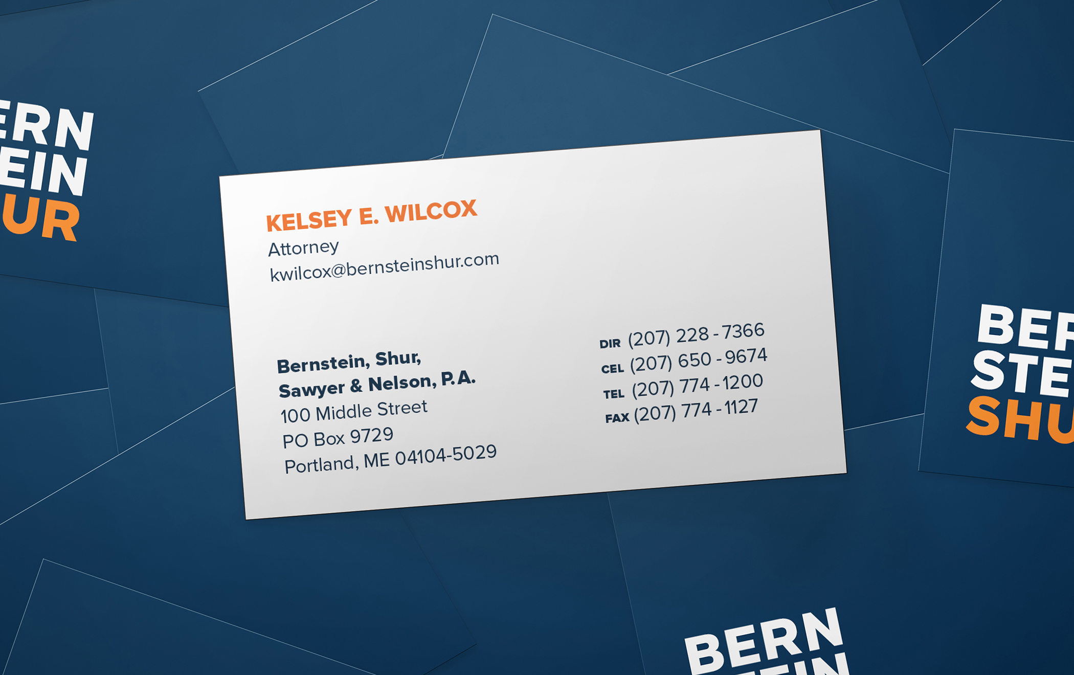 Close ups of the front and back of Bernstein Shur business cards.