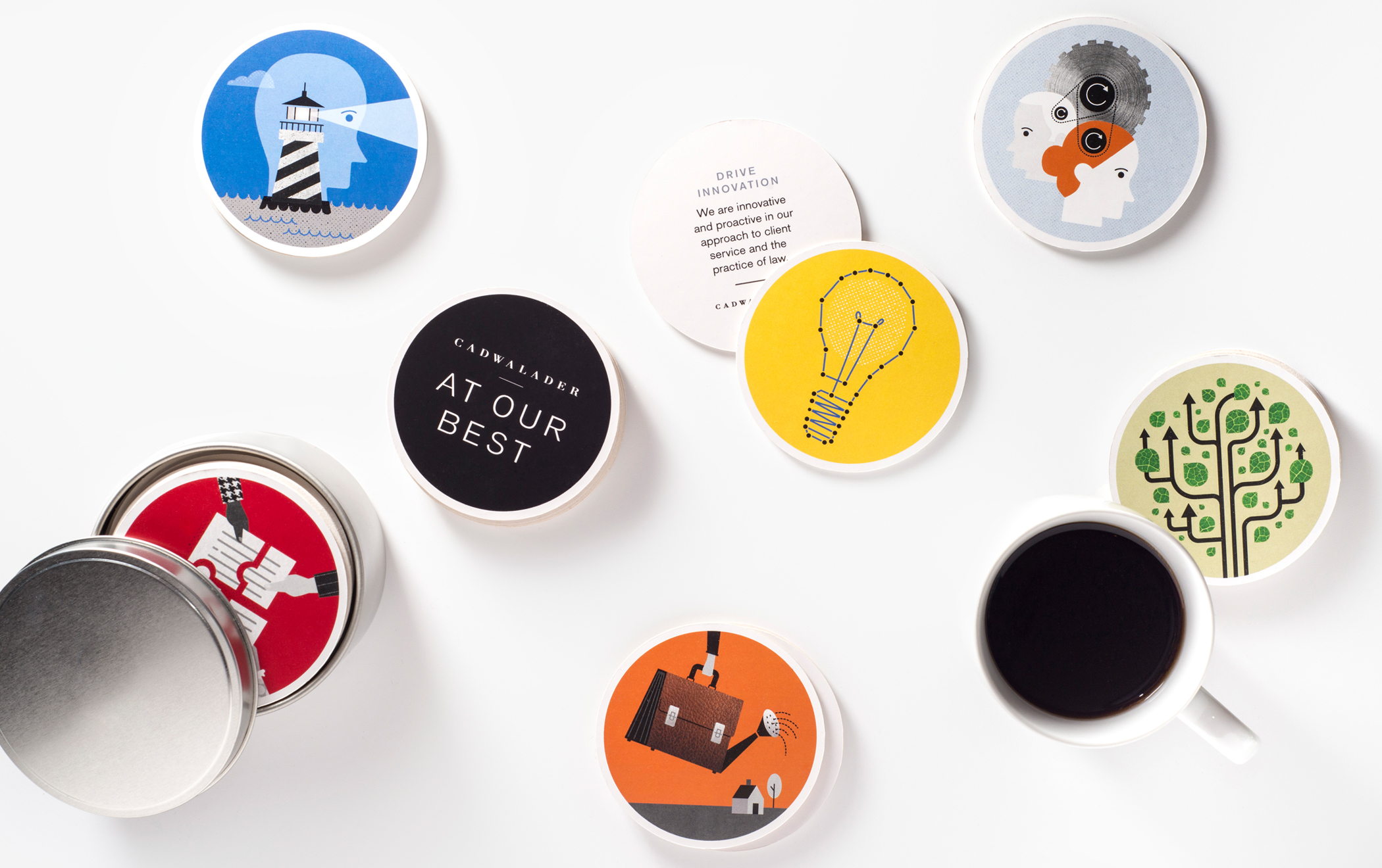 Several drink coasters with illustrationa the message "At our best" and "Drive innovation scattered on a tabletop.