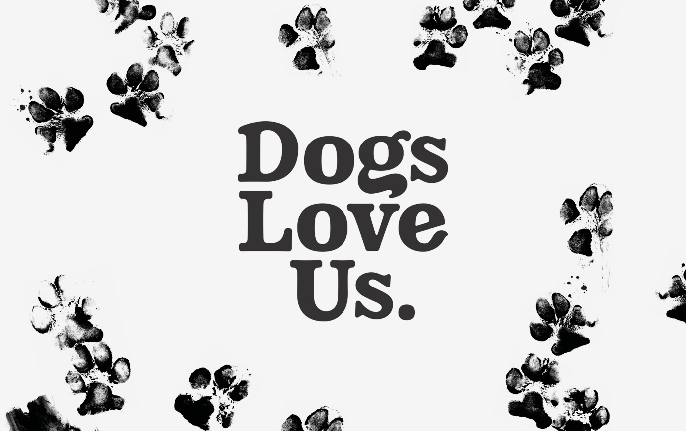 Black and white Dogs Love Us logotype with inked paw prints in the background.