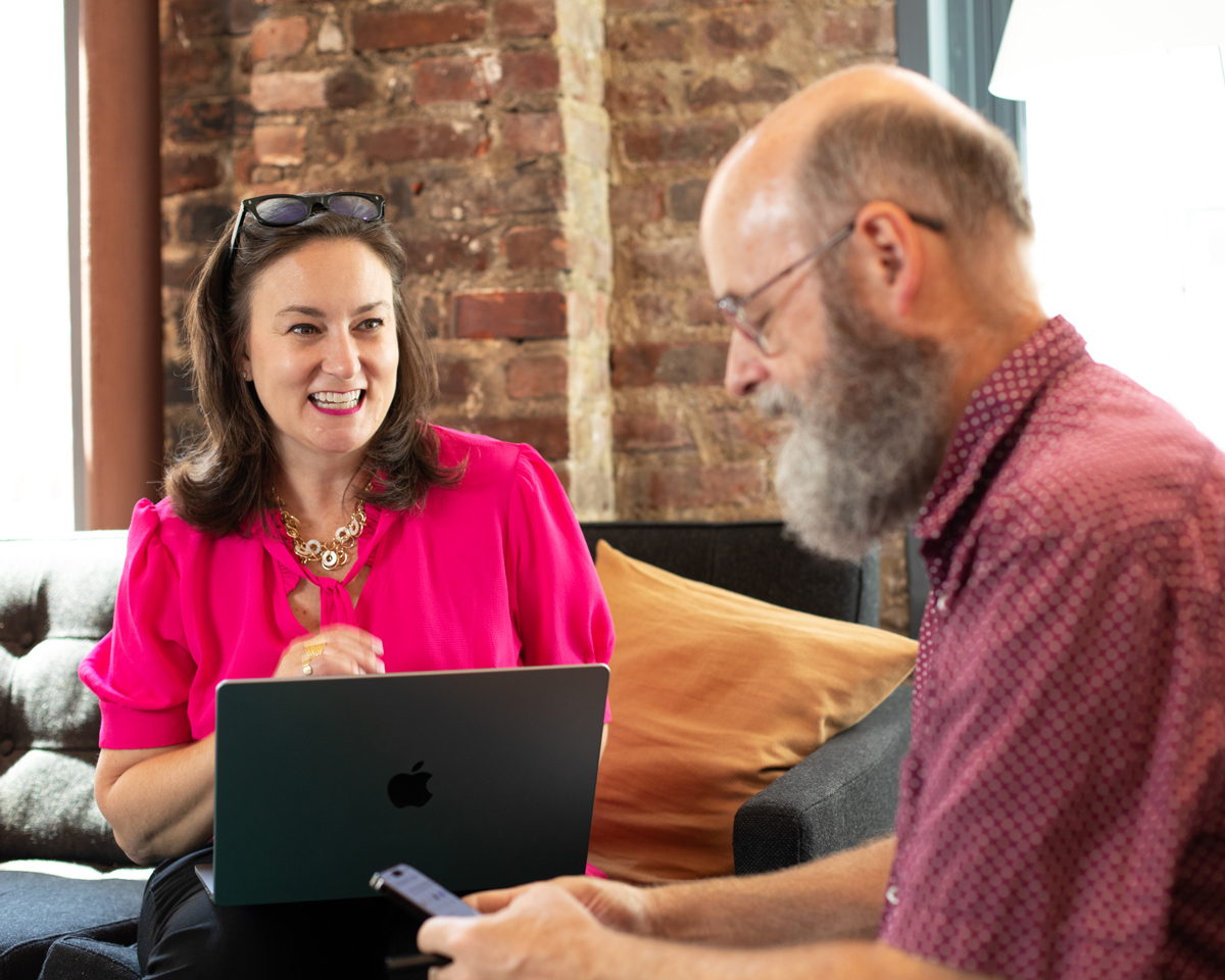 Elizabeth-and-Jay-laughing-while-they-work.jpg#asset:11164