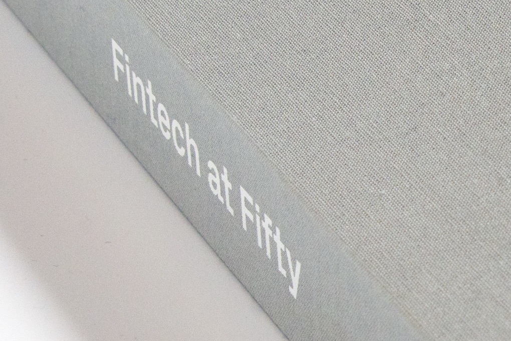 "Fintech at Fifty" printed on the spine of the linen covered custom case for Instinet's 50th anniversary graphic novel.