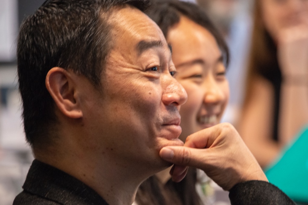 Close up of Takahiro Kurashima, an illustrator for Instinet's Fintech at Fifty graphic novel, and his Japanese interpreter.