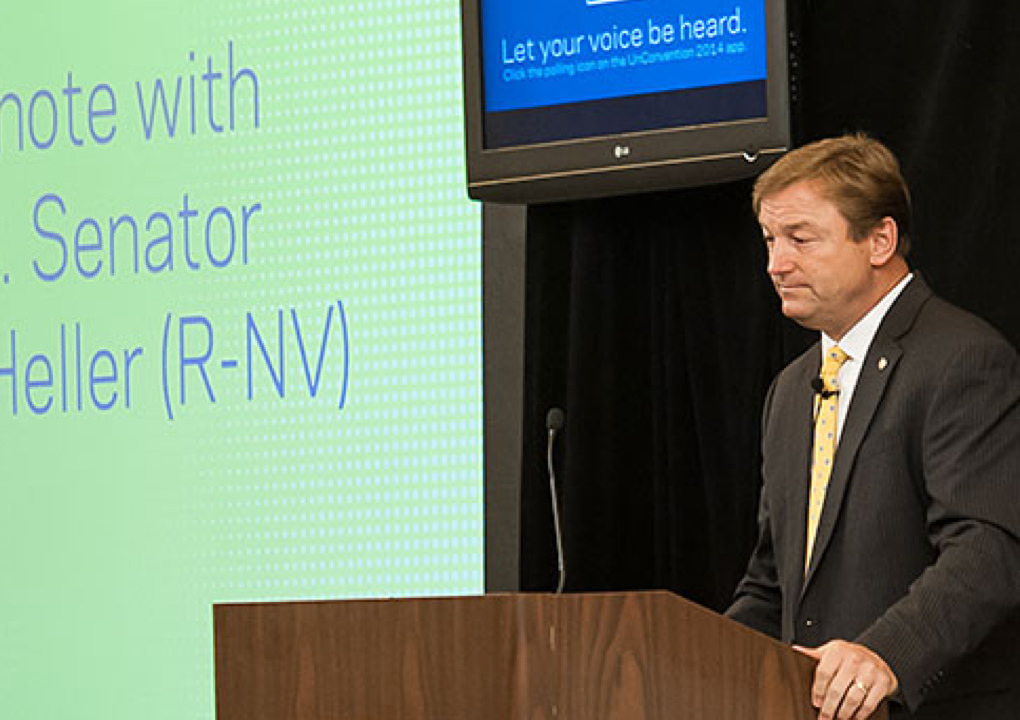 2014 KCG Uncon client event presenter at the podium with the presentation display in the background.