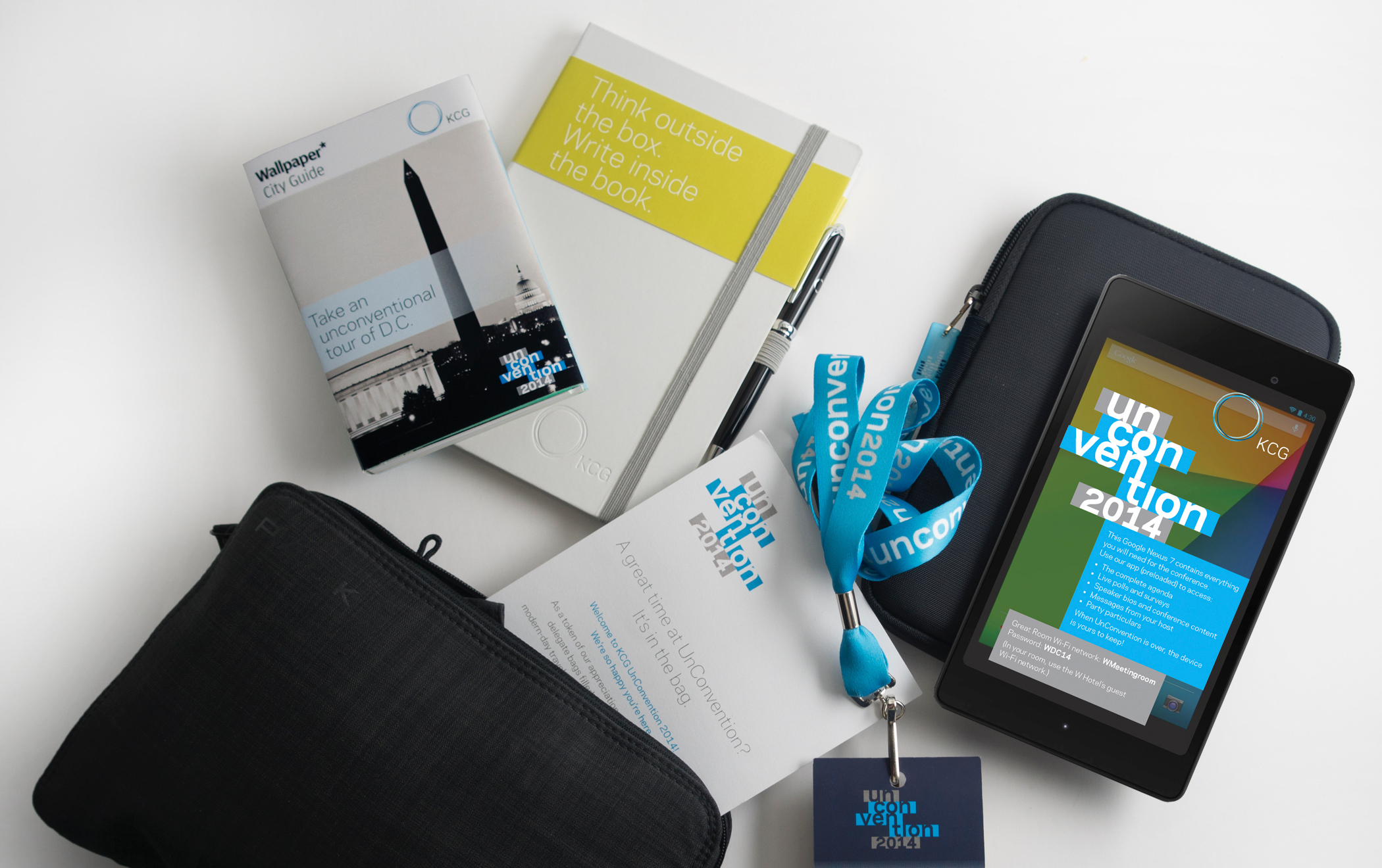 Several giveaway items from the 2014 KCG Uncon client event, including a digital table and map of Washington, DC.