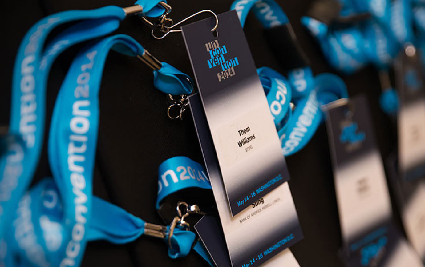 Close up of a stack of 2014 KCG Uncon client event attendee credentials on lanyards.