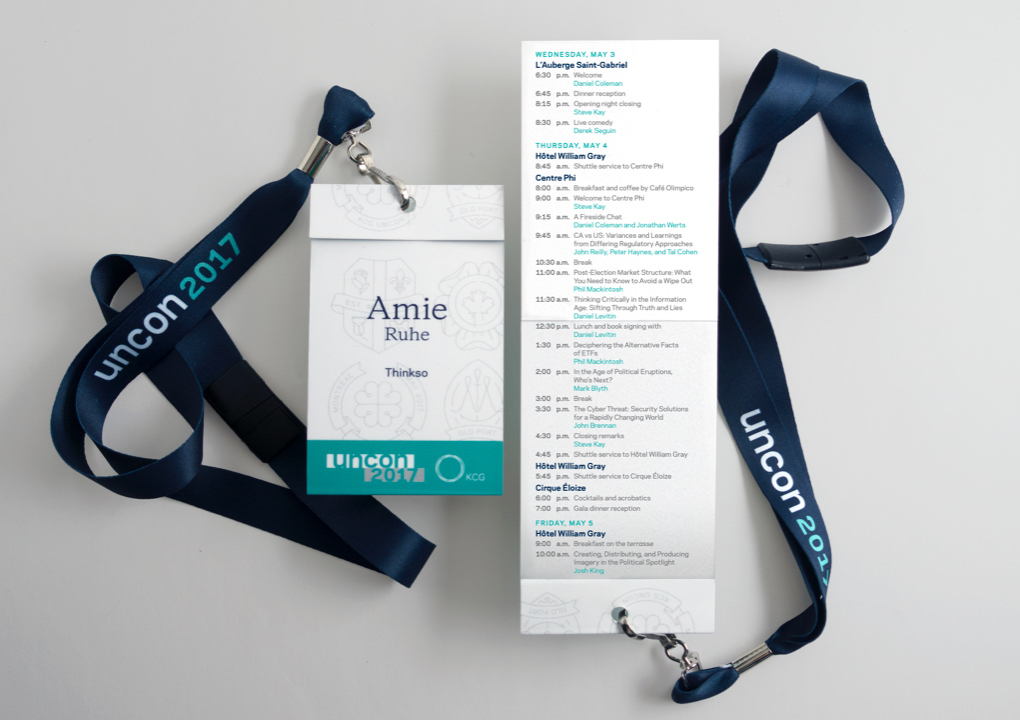 Close up of the 2017 KCG Uncon client event credentials and schedule care on lanyards.