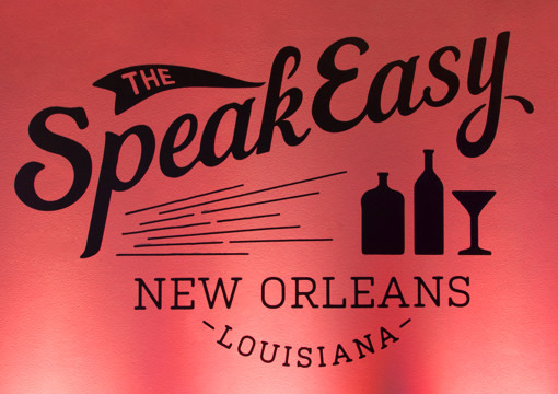 Custom wall art for the 2015 KCG Uncon client event after hours gathering reads "The Speakeasy, New Orleans, Louisiana."