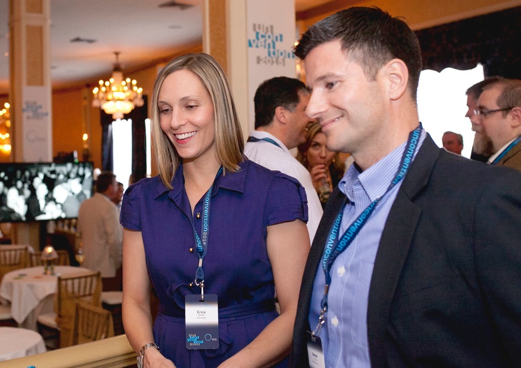 Close up if two 2015 KCG Uncon client event attendees enjoying a conference reception.