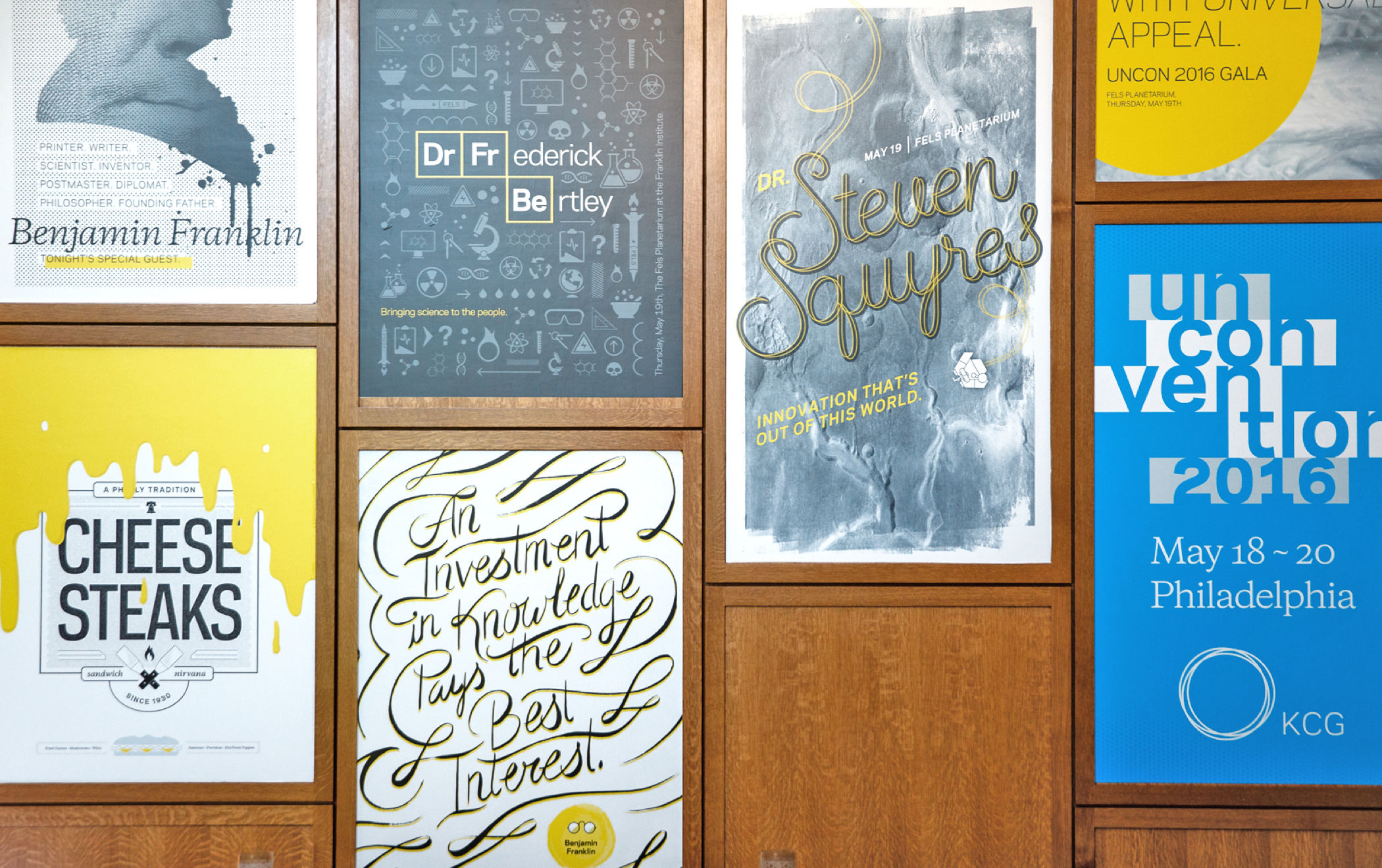 Several illustrated event posters on the wall of the meeting area at the 2016 KCG Uncon client event in Philadelphia.