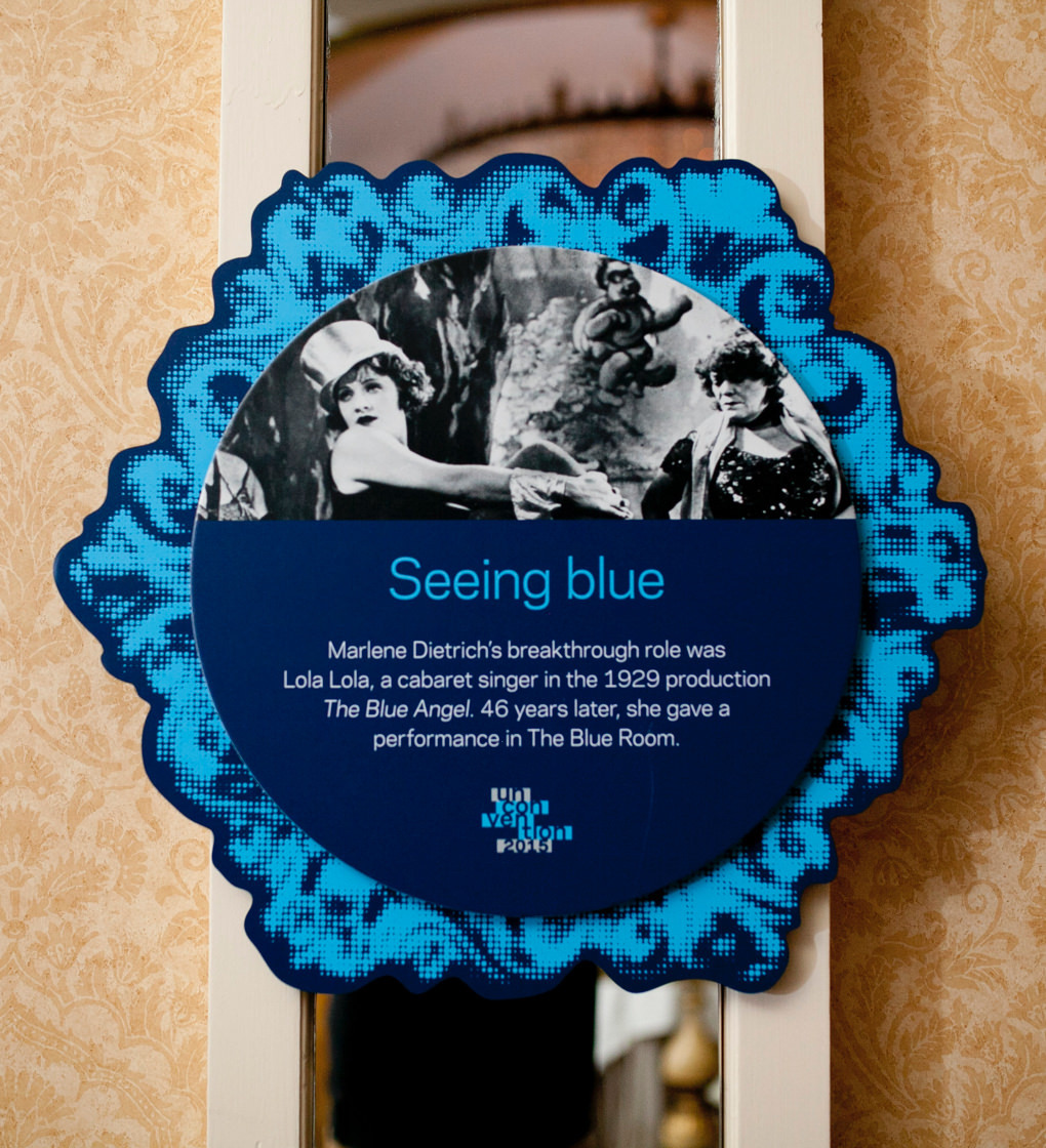 KCG Uncon event wall hanging with words "Seeing blue," other text, and a film still picture of the actress Marlene Dietrich.