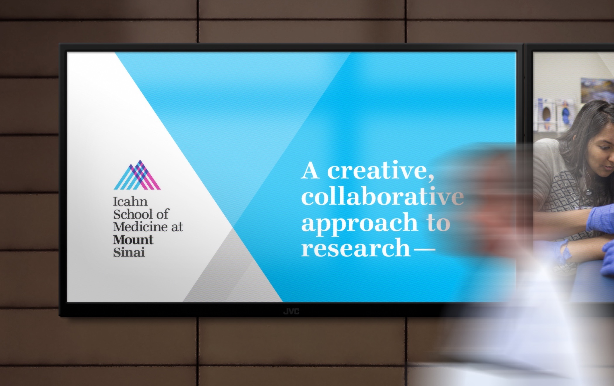 An Icahn School of Medicine at Mount Sinai screen presentation on a digital monitor with the title, A creative, collaborative approach to research.