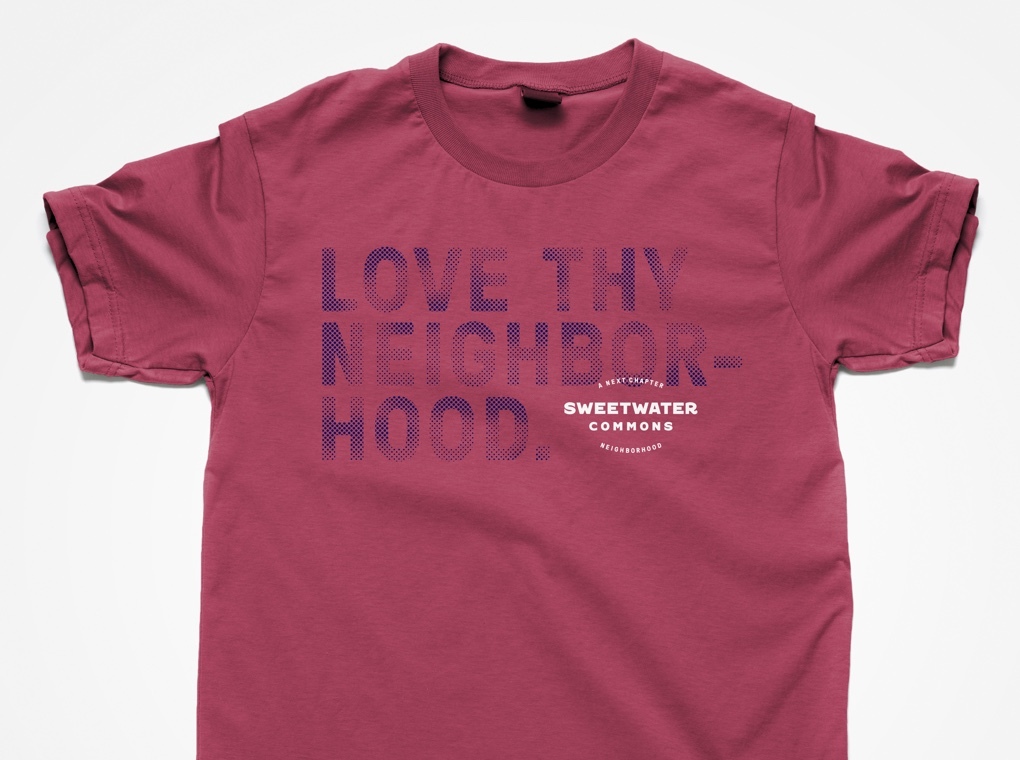 A Sweetwater Commons branded t-shirt printed with phrase "Love thy neighborhood."