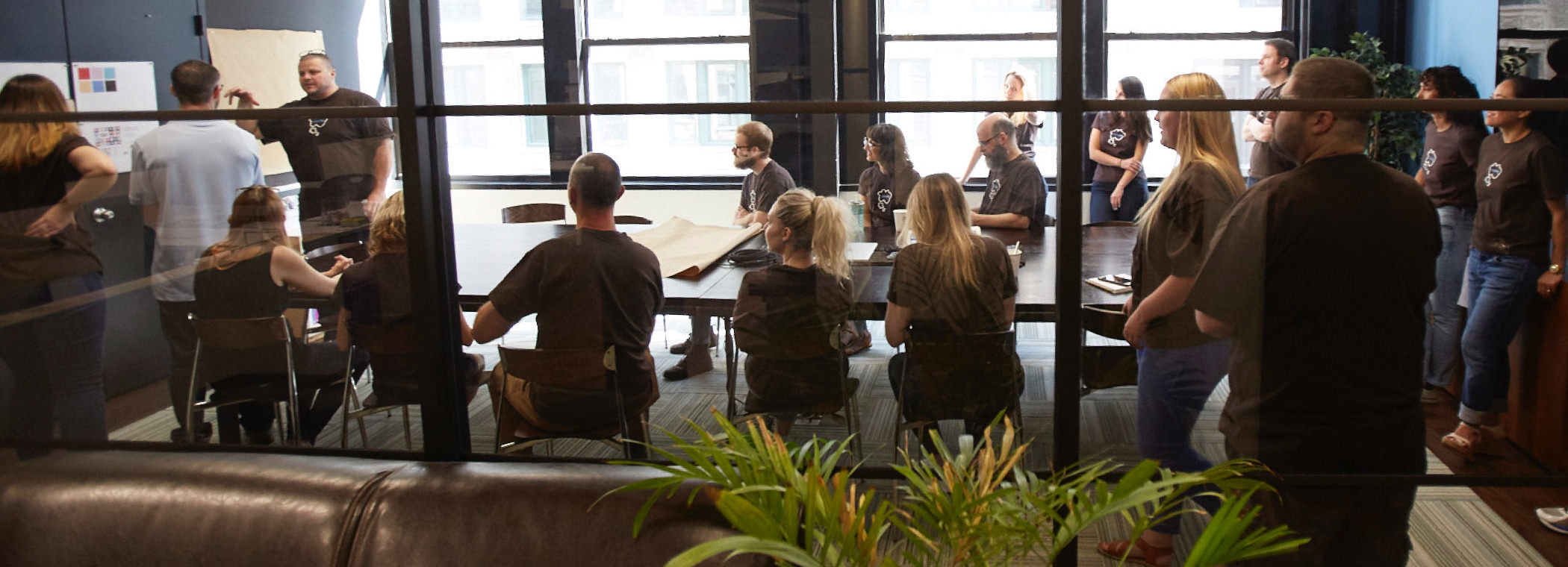 The Thinkso and Saul's Light teams reviewing work during the 2018 Give a Brand design sprint.