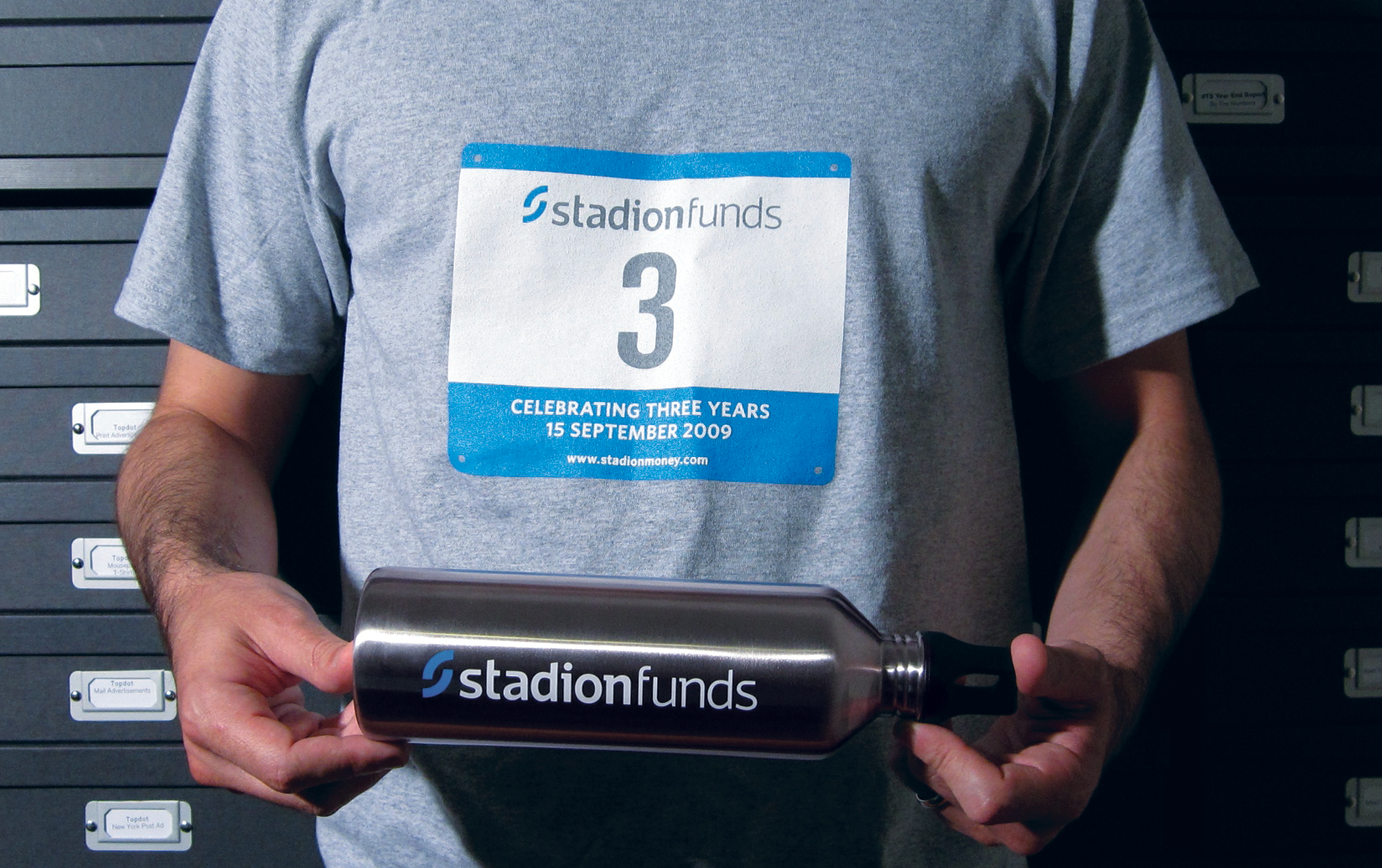 Stadion-branded promotional T shirt and water bottle.