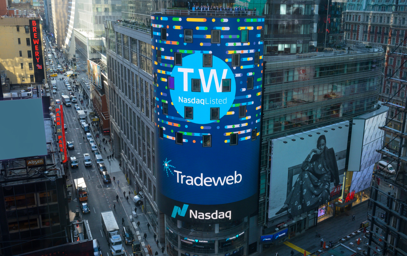 High wide shot of the the NASDAQ building in Times Square with the Tradeweb ticker and logo filling the building-high display