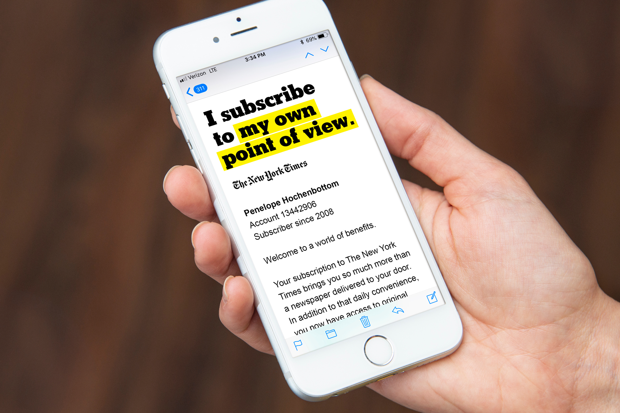 A New York Times promotional email with the headline "I subscribe to my own point of view" displayed on a smartphone.