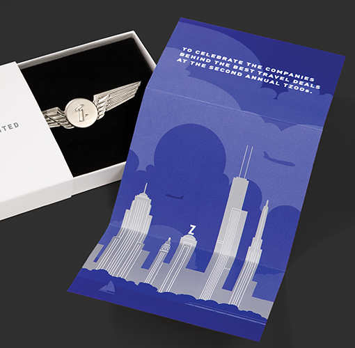 A wing-shaped medal and a card commemorating the winners of Travelzoo's annual "T zoos" travel awards.