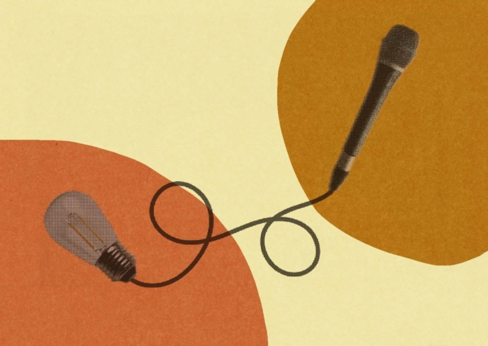 A microphone with a black wire attached to a lightbulb.