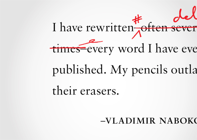 A paragraph marked up with proofreading edits in red ink.