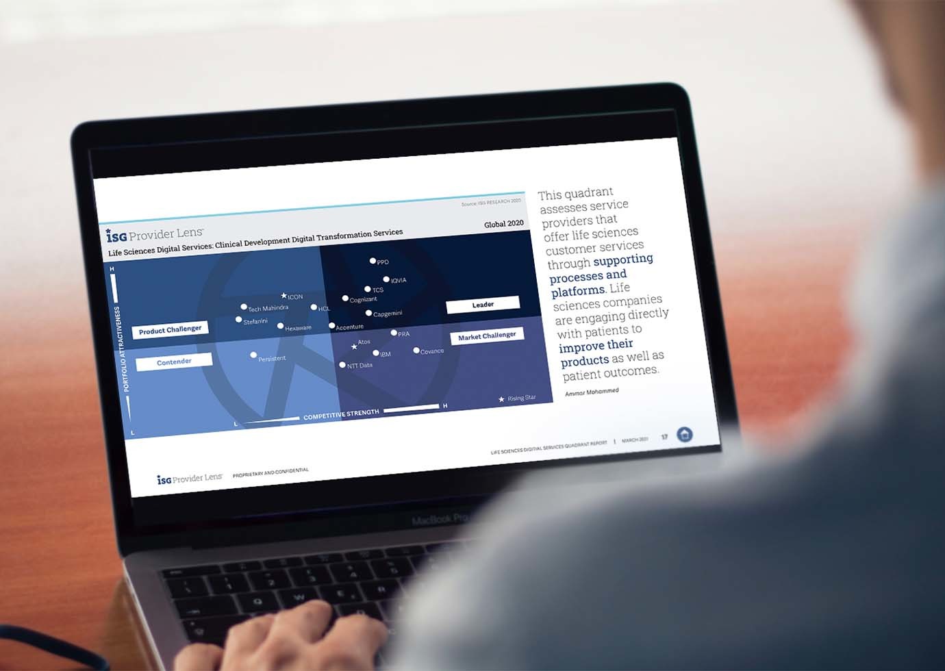 A laptop with an image of an ISG Providers Lens Quadrant page showing text and relative data on several technology services providers.