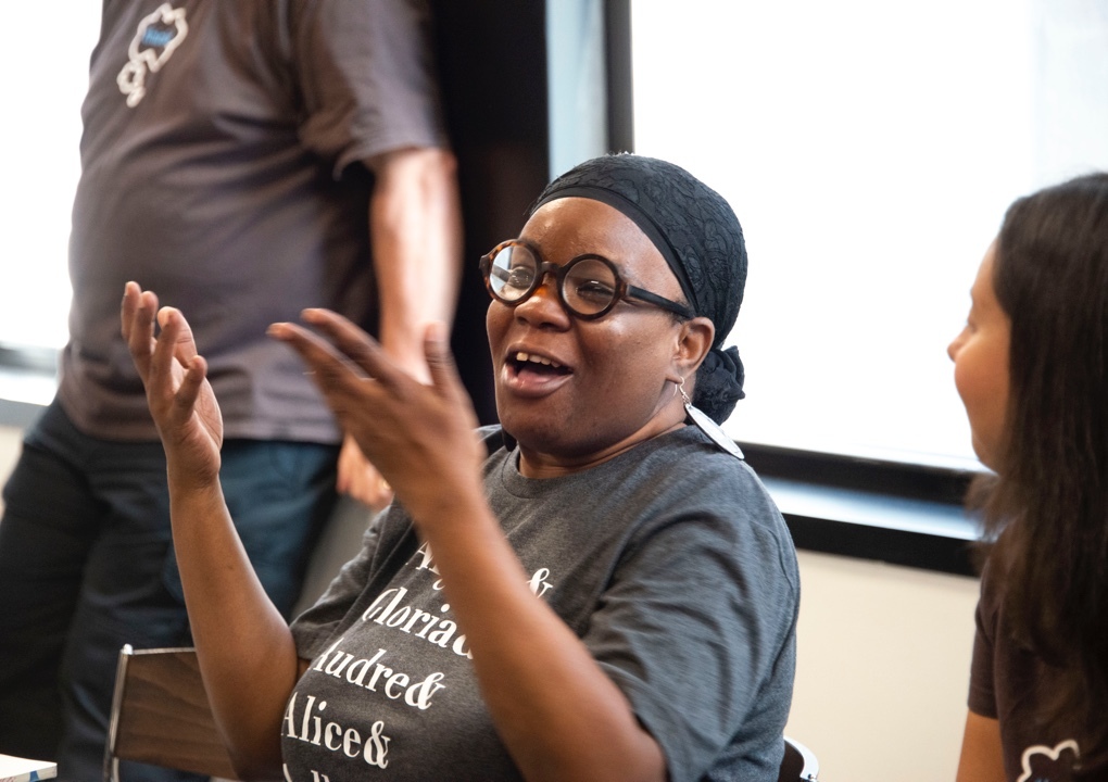 Project Nia founder and director Mariame Kaba sitting and gesturing to the Thinkso team.